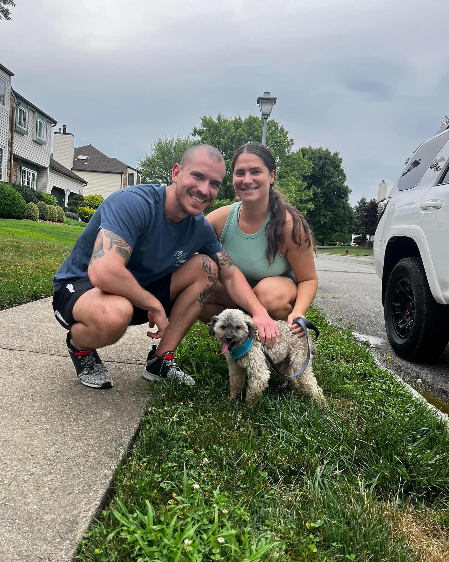 man woman and a poodle